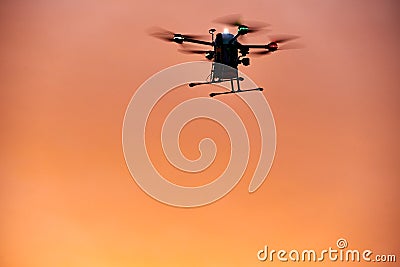 inovation drone with automated external defibrilator aed flying in sunset Stock Photo
