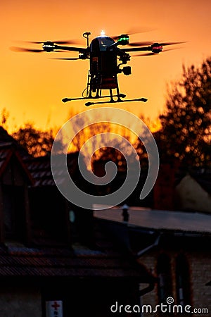 inovation drone with automated external defibrilator aed flying in sunset Stock Photo