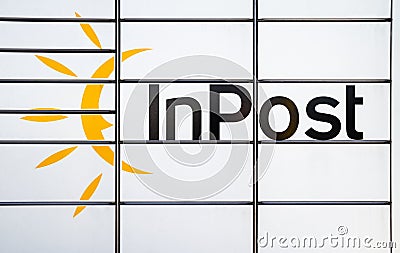 InPost logo sign on Paczkomat smart electronic steel parcel locker. Editorial Stock Photo