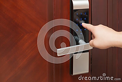 Inputing passwords on an electronic door Stock Photo