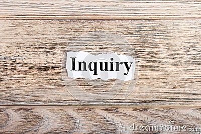 Inquiry text on paper. Word Inquiry on torn paper. Concept Image Stock Photo