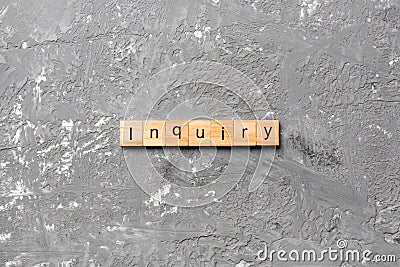 Inquiry word written on wood block. inquiry text on table, concept Stock Photo