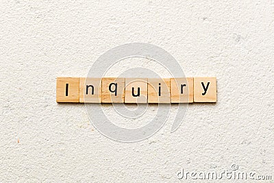 inquiry word written on wood block. inquiry text on table, concept Stock Photo