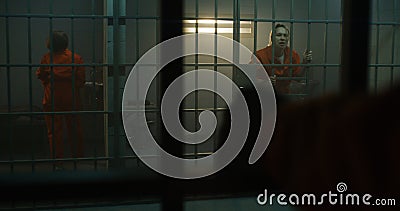 Insane female prisoner yells at neighbor inmate in jail Stock Photo