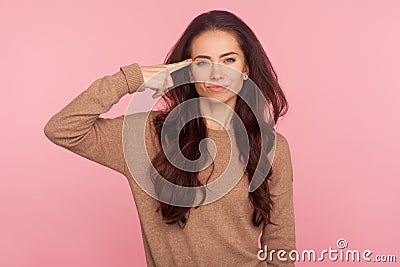 This is insane! Portrait of displeased woman annoyed with dumb idea showing stupid gesture, blaming some idiot Stock Photo
