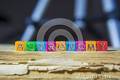 Inscription astronomy with old book on background Stock Photo