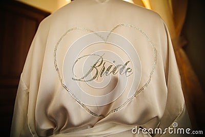 The inscription on the back of the girl from rhinestones - the bride Stock Photo
