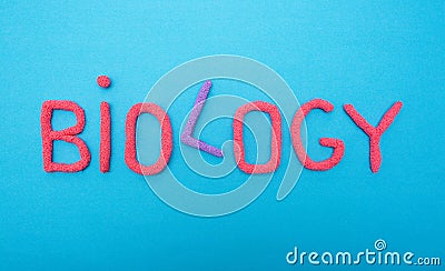 Inscription biology in red letters on a blue background, evolution science concept Stock Photo