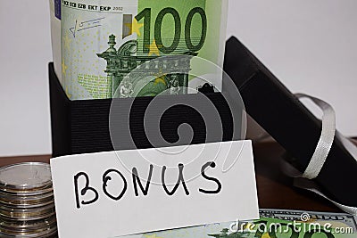 The inscription Bonus, gift wrapping with euro banknotes Stock Photo