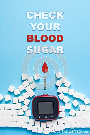 Inscription check your blood sugar, red blood drop, wall made of sugar cubes ruined by Glucose meter on blue background Stock Photo