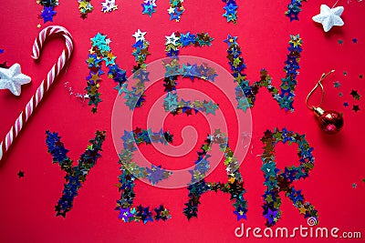 Inscription colored stars new year on a red background Stock Photo