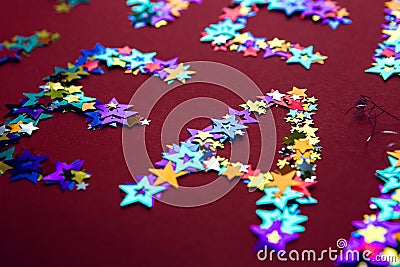 Inscription colored stars new year on a red background Stock Photo