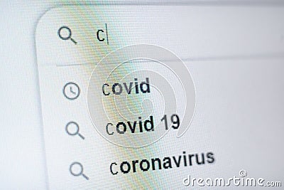 The inscription covid19 in the search bar on the monitor Stock Photo