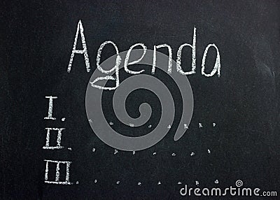 The inscription on the dark board Agenda with serial numbers and ellipses Stock Photo