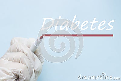 Inscription Diabetes and hand in medical glove on blue background, World Diabetes Day, medical concept Stock Photo