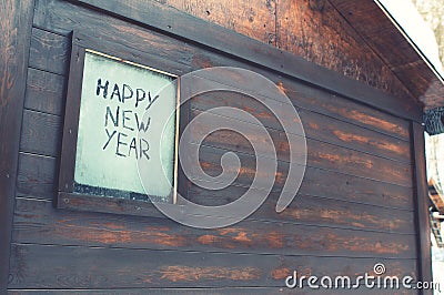 The inscription `Happy New Year` on the frosty window Stock Photo