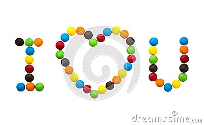 The inscription I love you and the Heart of multicolored round candies. Stock Photo