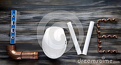 The inscription LOVE made up with construction tools. valentines composition with plumbing tools Stock Photo