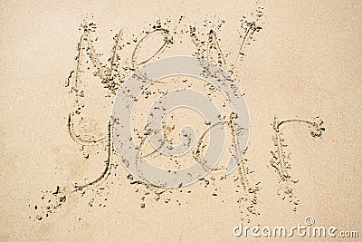 Inscription New year on sand Stock Photo