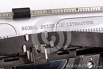 The inscription & x22;nobel prize in literature& x22; on a white sheet in a typewriter. Nobel prize in literature Stock Photo