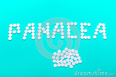 The inscription "Panacea" made of pills on a green background Stock Photo