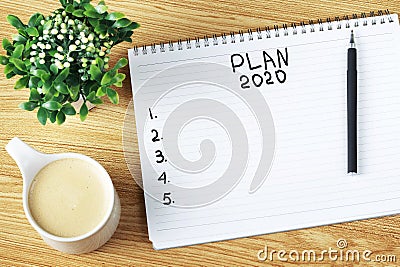 Inscription Plan 2020 in notepad, close-up, top view, concept of planning, goal setting Stock Photo