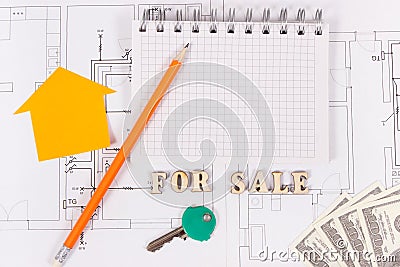 Inscription for sale, notepad, home keys and money on electrical diagrams, selling and buying house or flat concept Stock Photo