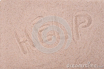 The inscription on the sand Help, close-up Stock Photo