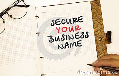 inscription SECURE YOUR BUSINESS NAME on white paper Stock Photo