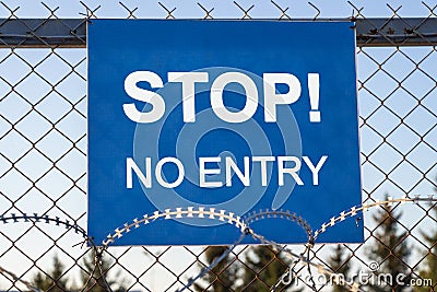 The inscription `STOP! No entry` on a blue plate Stock Photo