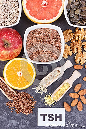 Inscription TSH with nutritious products and ingredients containing vitamins for healthy thyroid Stock Photo