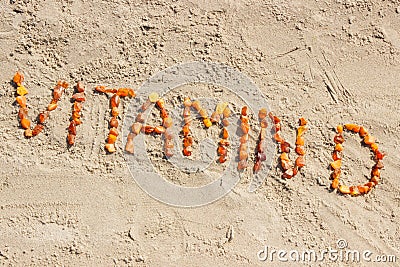 Inscription vitamin D on sand at beach, summer time and healthy lifestyle Stock Photo