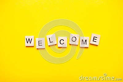 The inscription welcome made of wooden blocks Stock Photo