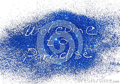 Inscription Welcome to Paradise of blue glitter sparkle on white background Stock Photo