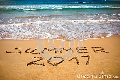 Inscription on wet sand Summer 2017. Concept photo of summer vacation on the tropical island ocean beach Stock Photo