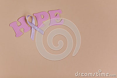 Inscription word hope and ribbon on background Stock Photo