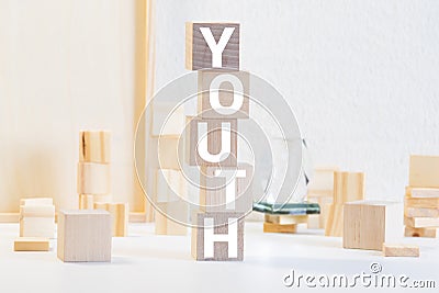 inscription Youth arranged from blocks strung on a string Stock Photo