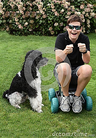 Inseparable friends, a boy and his dog Stock Photo