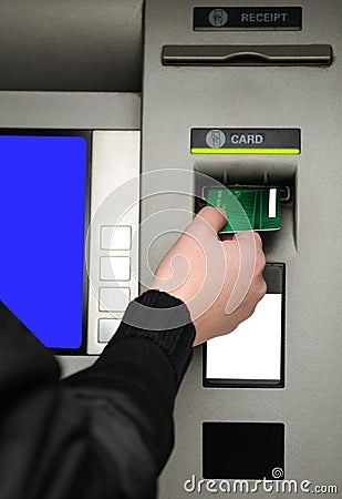 Inserting plastic card visa into ATM Stock Photo