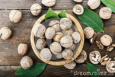 Inshell walnuts on a wooden background Stock Photo