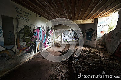 Inside an abandoned WWII concrete casemate with graffiti on the French Atlantic coast Editorial Stock Photo