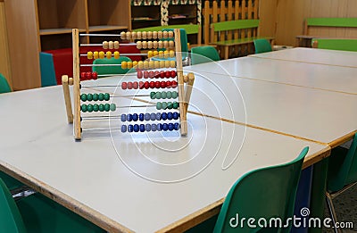 inside a classroom of kindergarten and an old wooden abacus Stock Photo