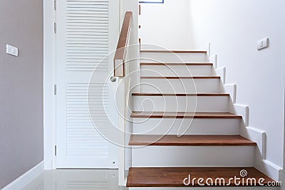 Inside contemporary white modern house with wood staircase Stock Photo