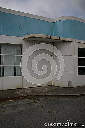 Inside corner of former gas station building Stock Photo