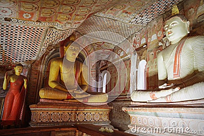 Inside of Dambulla cave temple. Statues of Buddha in ancient stone temple Editorial Stock Photo