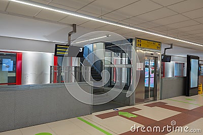 Inside Empty Train Station: Stairs and Transparent Elevator for Access to Platforms Two and Three Stock Photo