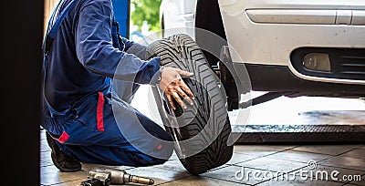 Inside a garage - changing wheels/tires Stock Photo