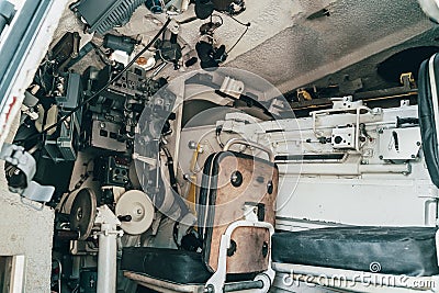 Inside military combat vehicle, gunner`s seat with seat and instruments Stock Photo
