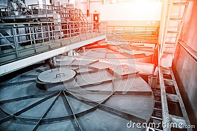 Inside modern wastewater treatment plant. Closed sewage reservoir with dirty water Stock Photo