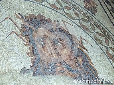 Mosaic of Oceanus, god of the sea, inside the Museum named Museu Muncipal de Faro at the Algarve coast of Portugal Editorial Stock Photo